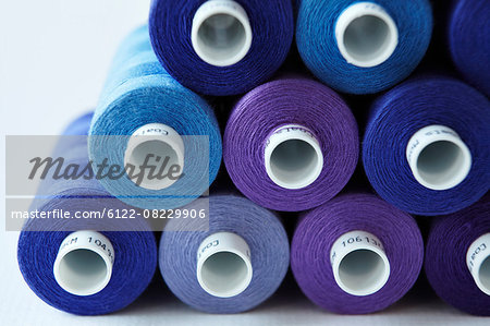 Close up of blue spools of thread