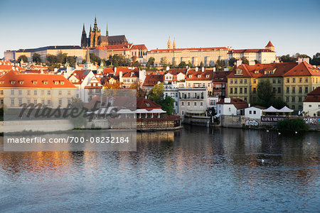 Harbor scene with St Vitus Cathedral in background at sunset, Prague, Czech Republic