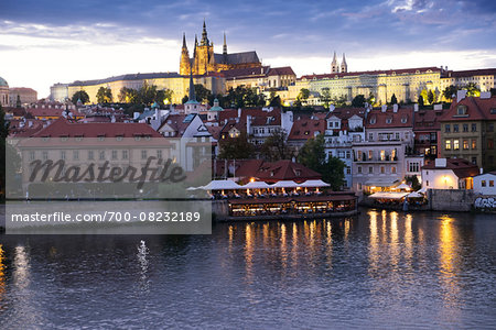 Harbor scene with St Vitus Cathedral in background at dusk, Prague, Czech Republic