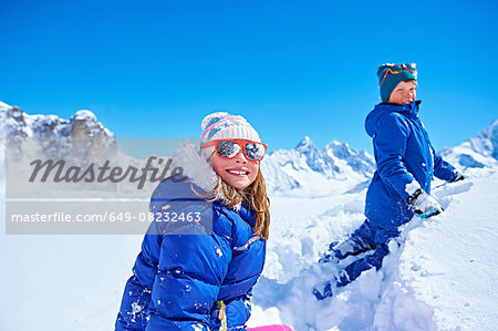 Siblings playing in snow, Chamonix, France