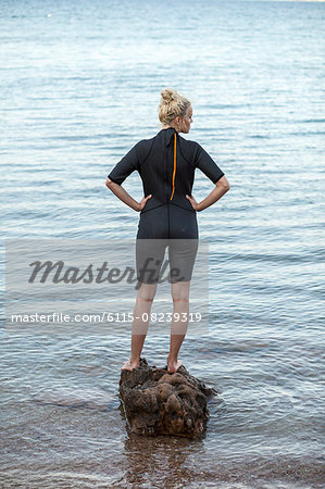 Young woman wearing wetsuit