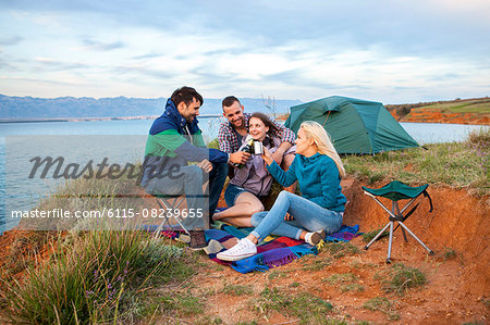 Group of friends at campsite celebrating