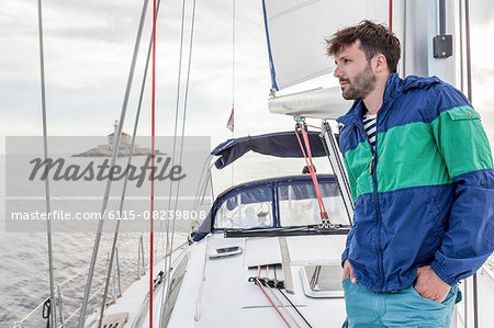 Man overlooking sea from sailboat, Adriatic Sea