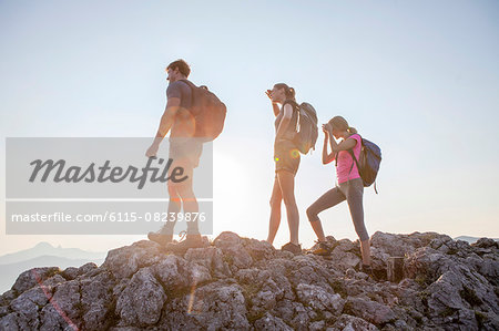 Group of friends overlooking mountain landscape