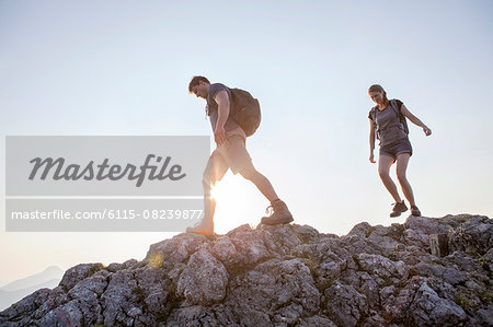 Young couple hiking in mountain landscape