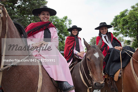 Women in a parade of gauchos in traditional costumes in Salta, Argentina,South America