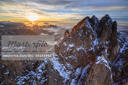 Aerial shot of Sassolungo at sunset, Sella Group, Val Gardena in the Dolomites, Val Funes, Trentino-Alto Adige South Tyrol, Italy, Europe