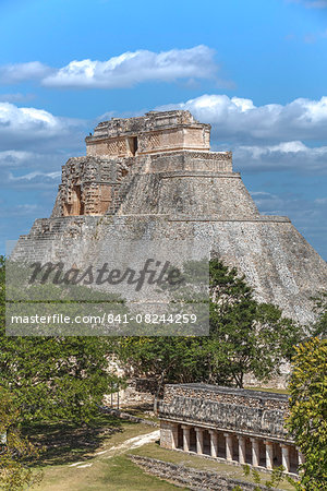 Columns Building in the foreground, and Pyramid of the Magician beyond, Uxmal, Mayan archaeological site, UNESCO World Heritage Site, Yucatan, Mexico, North America Columns Building in the foreground, and Pyramid of the Magician beyond, Uxmal, Mayan archaeological site, UNESCO World Heritage Site, Yucatan, Mexico, North America