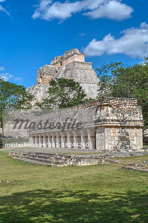 Columns Building in foreground with Pyramid of the Magician beyond, Uxmal, Mayan archaeological site, UNESCO World Heritage Site, Yucatan, Mexico, North America