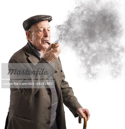 Old man reflecting while smoking his pipe