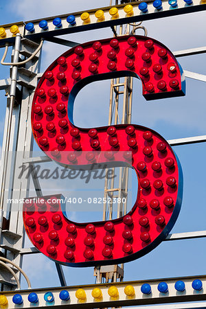 classic electric sign like the ones used in circus or old fashioned shops representing the S letter