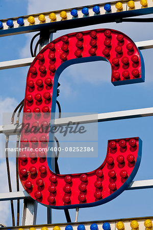 classic electric sign like the ones used in circus or old fashioned shops representing the C letter