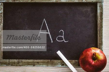 Back to school concept. Apple and chalkboard. Copy space