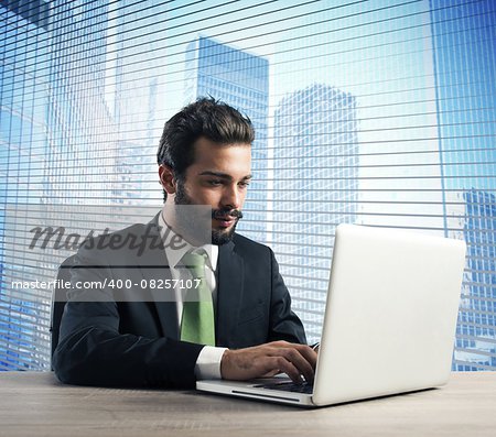 Businessman working in his office with laptop