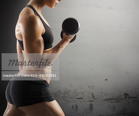 Athletic muscular woman workout with grunge background