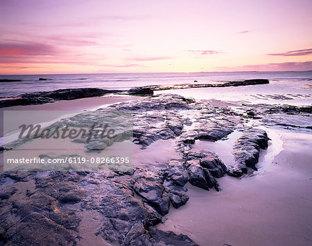 Sunrise over North Sea from Bamburgh beach, Bamburgh, Northumberland, England, United Kingdom, Europe