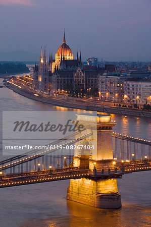 Panorama of city at dusk with the Hungarian Parliament building, and the Chain bridge ( Szechenyi Lanchid), over the River Danube, UNESCO World Heritage Site, Budapest, Hungary, Europe