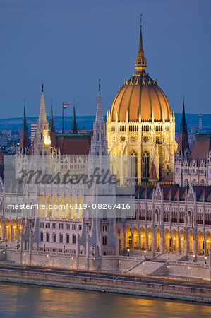 The neo-gothic Hungarian Parliament building, designed by Imre Steindl, illuminated at night, and the River Danube, UNESCO World Heritage Site, Budapest, Hungary, Europe