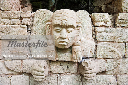 Sculpted head stone at Mayan archeological site, Copan Ruins, UNESCO World Heritage Site, Honduras, Central America