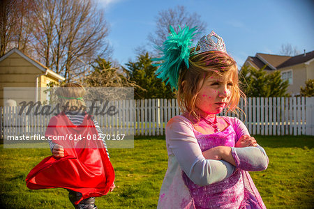 Children in costumes sulking after fight