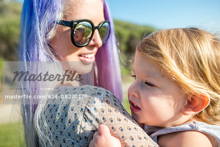 Mother and baby enjoying sun, El Capitan, California, USA