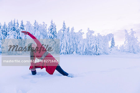 Smiling woman doing yoga