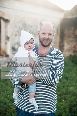 Father holding baby girl