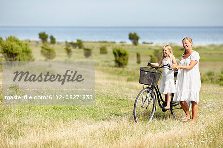 Mother with daughter on bicycle