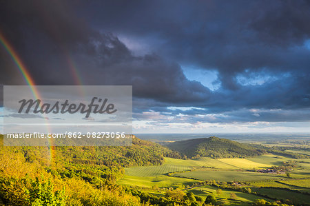 United Kingdom, England, North Yorkshire. A clearing storm and rainbow over Sutton Bank.