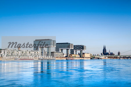 Crane houses, Cologne Cathedral and River Rhine, Rheinauharbour, Cologne, North Rhine Westphalia, Germany