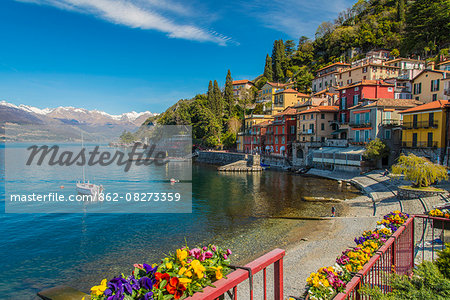 Scenic springtime view of Varenna with snowy Alps in the background, Lake Como, Lombardy, Italy