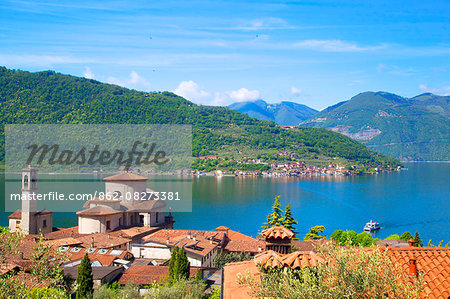 Italy, Lombardy, Lake Iseo. Along the Antica Strada Valeriana which runs across part of the lake with the Church at Sale Marasino and Monte Isola.