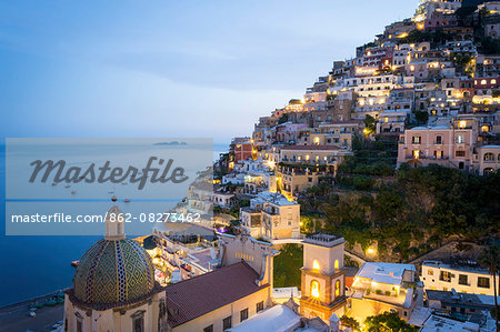 Positano, Amalfi Coast, Campania, Sorrento, Italy. View of the town and the seaside in a summer sunset