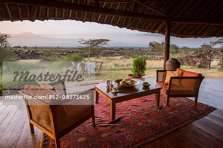 Kenya, Amboseli, Tortilis Camp. Comfy armchairs and breakfast set, overlooking Kilimanjaro.