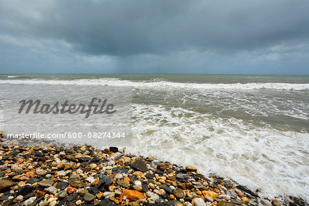 Pebble Beach with Rough Sea and Storm Clouds, Captain Cook Highway, Queensland, Australia