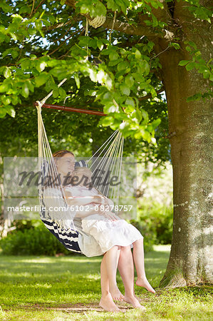 Mother with daughter on hammock