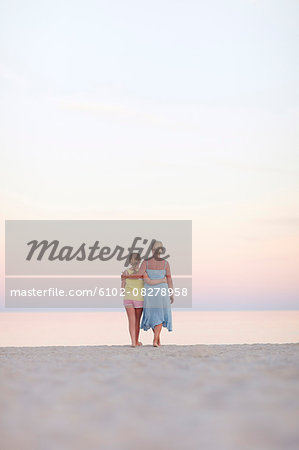 Mother with daughter on beach