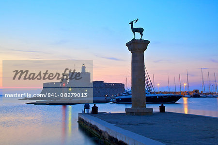 Bronze Doe and Stag statues at the entrance of Mandraki Harbour, Rhodes, Dodecanese, Greek Islands, Greece, Europe