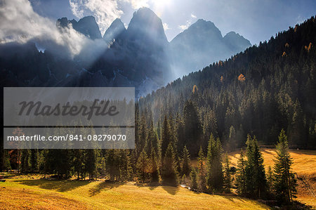 Green meadows and colorful woods in autumn frame the Odle, Malga Zannes, Funes Valley, South Tyrol, Dolomites, Italy, Europe