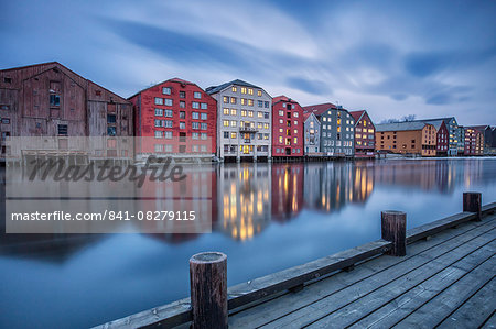 The lights of the houses reflected in the River Nidelva, Bakklandet, Trondheim, Norway, Scandinavia, Europe