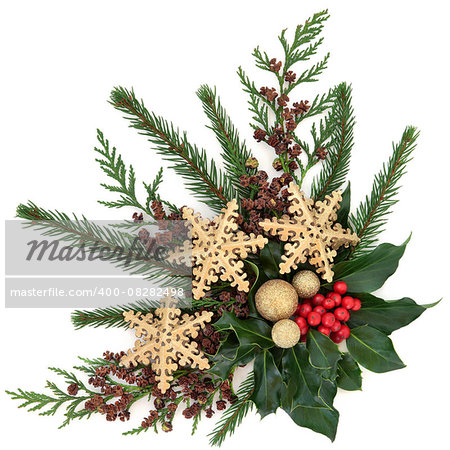 Christmas flora with gold snowflake and sparkling baubles with holly, ivy, fir and cedar cypress over white background.