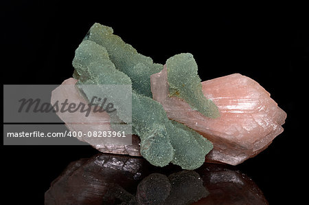 Sample of a beautiful  Stilbite with Apophyllite  gemstone speciment isolated on black background