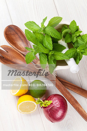 Fresh herbs and spices on wooden table. Top view