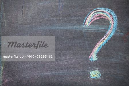 Colorful chalk question mark on blackboard background with copy space