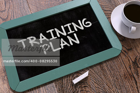 Hand Drawn Training Plan Concept  on Small Blue Chalkboard. Business Background. Top View.