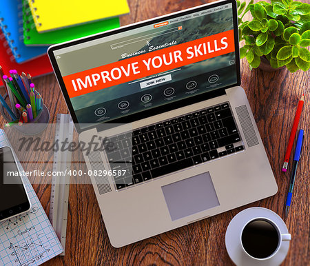 Improve Your Skills Concept. Modern Laptop and Different Office Supply on Wooden Desktop background.