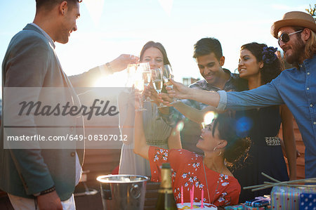 Friends at outdoor party making a toast