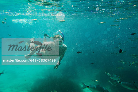 Underwater view of mature man snorkeling, Menorca, Balearic islands, Spain