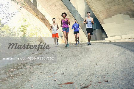 Joggers running on bridge, Arroyo Seco Park, Pasadena, California, USA