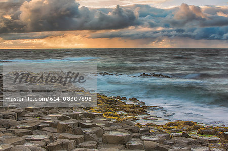 High angle view of Giants Causeway, ocean and dramatic sky, Bushmills, County Antrim, Ireland, UK